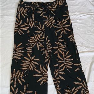 Pleated tribal pants with floral designs